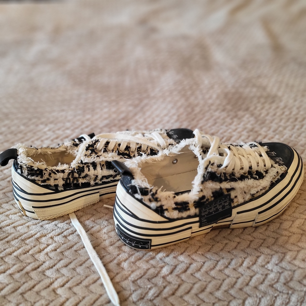 Handcrafted, low-top sneaker with a chunky, deconstructed midsole. USED
